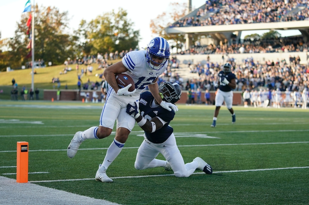 (Paul Abell | AP) BYU wide receiver Puka Nacua, top, scores a touchdown against Georgia Southern safety Anthony Wilson in the first half of an NCAA college football game Saturday, Nov. 20, 2021, in Statesboro, Ga.