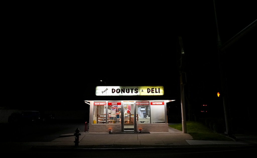 (Bethany Baker | The Salt Lake Tribune) Lights illuminate Fresh Donuts and Deli in the early morning hours in South Salt Lake on Thursday, Sept. 12, 2024. The store has been open at 2700 South and State Street in South Salt Lake for 25 years, run by a husband and wife who both came to the United States from Cambodia.