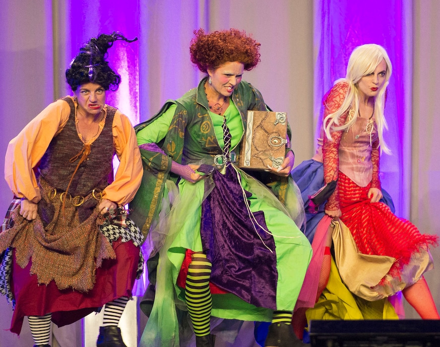 People dressed as characters from "Hocus Pocus" attend the Disney biannual fan convention D23 at the Anaheim Convention Center in Anaheim, Calif., Friday, July 14, 2017. (Matt Masin/The Orange County Register via AP)