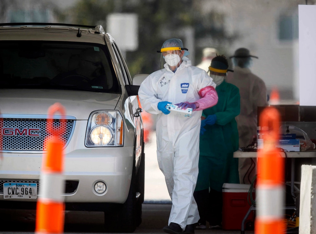 Medical staff administer COVID-19 tests to the public at the Iowa Events Center parking lot in Des Moines on Saturday, April 25, 2020. The tests were done by appointment only.  (Bryon Houlgrave /The Des Moines Register via AP  )