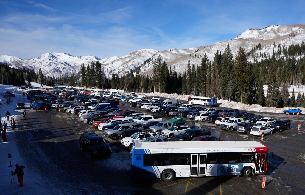 (Francisco Kjolseth | The Salt Lake Tribune) Ski buses stop at Solitude Mountain Resort on Wednesday, Dec. 6, 2023, during regular intervals to load and unload skiers and snowboarders. Representatives from Brighton and Solitude Resort, the Town of Brighton, UTA, and Ski Utah, recently spoke about the steps each organization is taking to reduce vehicle congestion in Big Cottonwood Canyon and enhance the arrival experience for the new winter season.