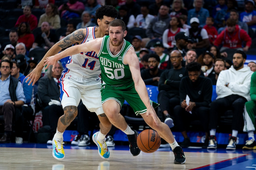 Boston Celtics' Svi Mykhailiuk, right, drives to the basket after getting past Philadelphia 76ers' Danny Green during the first half of a preseason NBA basketball game Wednesday, Oct. 11, 2023, in Philadelphia. (AP Photo/Chris Szagola)
