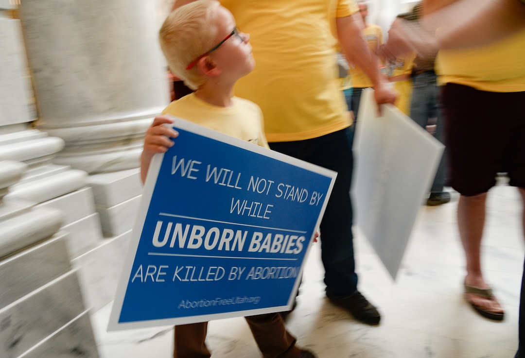 (Francisco Kjolseth  |  The Salt Lake Tribune) James Bullen, 7, of Lehi joins his parents as they attend an Abortion-Free Utah public campaign to end elective abortion in the state of Utah during a press event in the rotunda of the Utah Capitol on Wed. June 19, 2019.