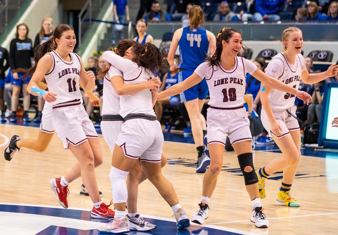 (Rick Egan | The Salt Lake Tribune) Lone Peak celebrates their 67-65 double-overtime win over Fremont, in the 6A State Championship game, at the Marriott Center in Provo, on Saturday, March 5, 2022.  Ika, hit the winning shot with .5 seconds left on the clock. 