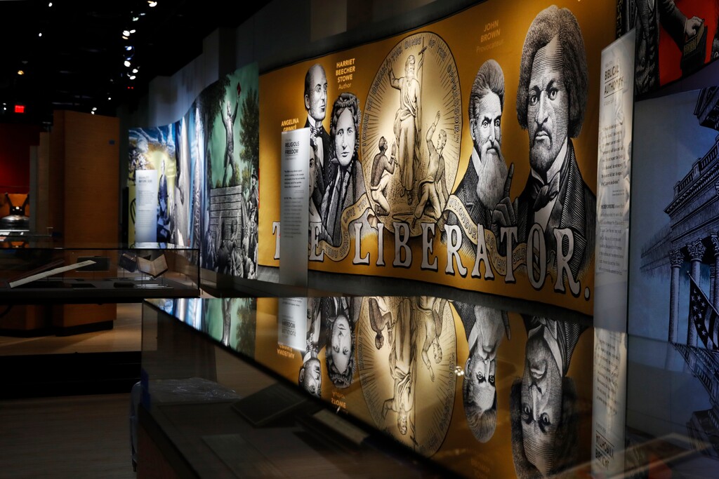 (AP Photo/Jacquelyn Martin) An exhibit discussing slavery and the Bible in the United States is displayed inside the Museum of the Bible, Monday, Oct. 30, 2017, in Washington.