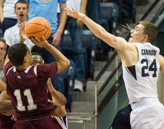 (Rick Egan  |  The Salt Lake Tribune)   Texas Southern Tigers guard Brian Carey (11) shoots as Brigham Young Cougars guard McKay Cannon (24) defends, in basketball action, Brigham Young Cougars vs Texas Southern Tigers, at the Marriott Center in Provo, Saturday, December 23, 2017.