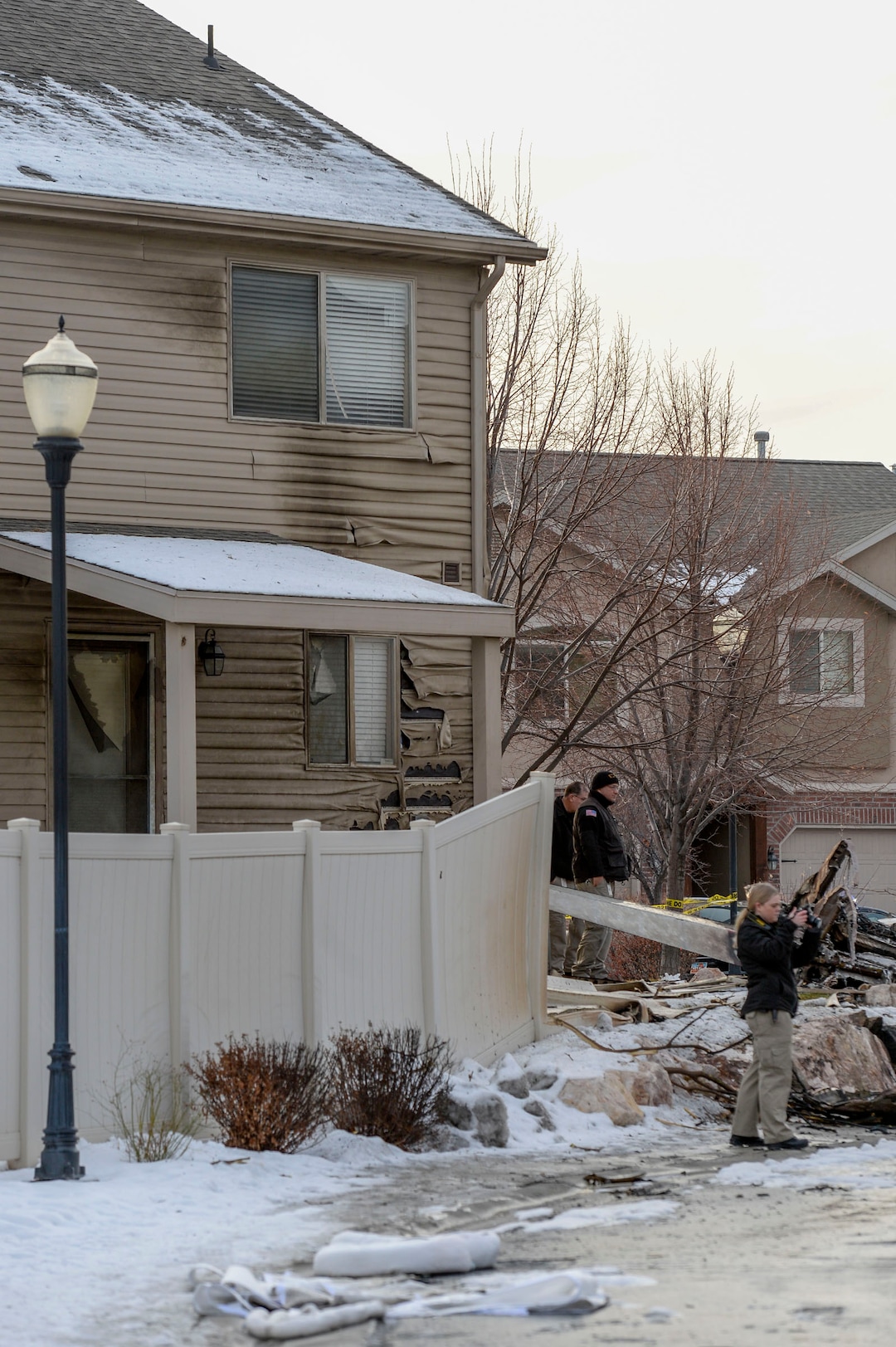(Leah Hogsten  |  The Salt Lake Tribune) Weber County emergency personnel and firefighters work the scene of a small, private plane that crashed in a residential neighborhood in Roy, Jan 15, 2020.  A 64-year-old pilot was killed.
