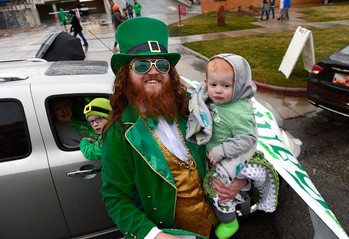 (Scott Sommerdorf | The Salt Lake Tribune) Patrick Gallagher holds Finn Gallagher as they get ready for the 40th annual Salt Lake City St. Patrick's Day Parade on, Saturday, March 17, 2018.