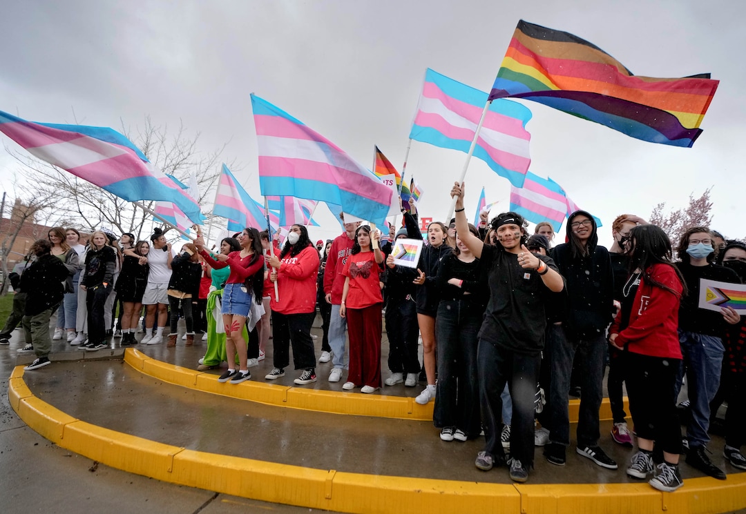 (Francisco Kjolseth | The Salt Lake Tribune) East High school students gather in front of the school during a walkout on Friday, April 15, 2022, to protest HB11, which bans transgender girls from participating in female school sports. In the same spirit of the West High walkout last week, students took a stand to speak out against the bill which they found discriminatory and hurtful to transgender youth in the state.