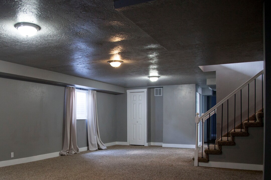 (Stella Yu |  The Salt Lake Tribune) The 2,713-square-foot rambler home in South Jordan includes five bedrooms, three and a half baths, two family rooms, a fireplace, a kitchen, a bar and a semi-formal dining room. A two-car garage is attached to the house with outdoor RV parking space.