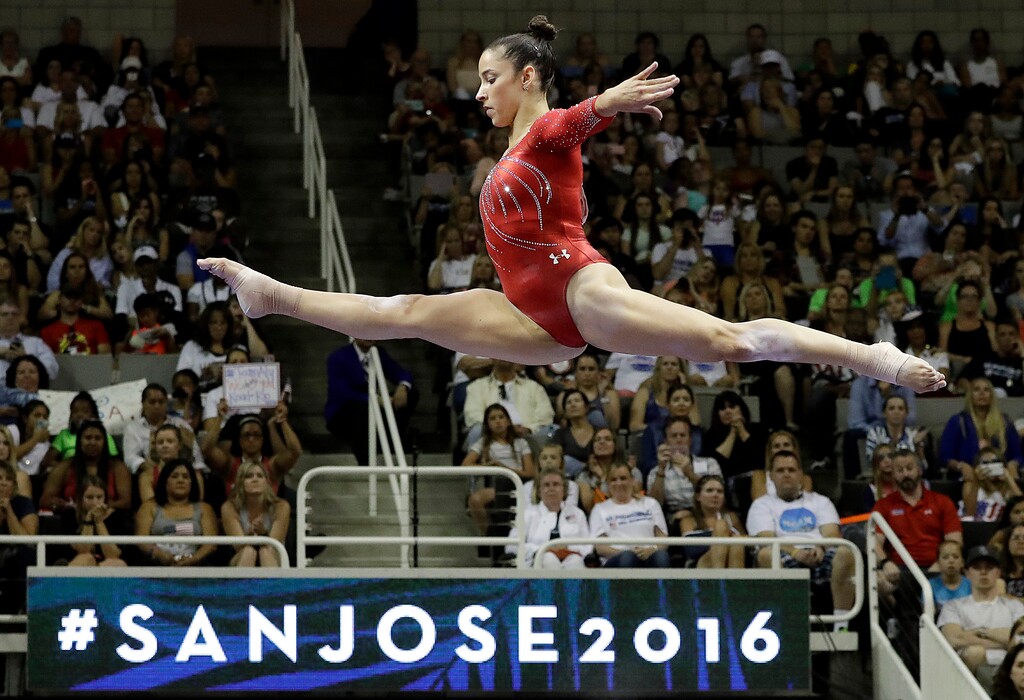 (Gregory Bull | The Associated Press) Aly Raisman competes on the balance beam during the women's U.S. Olympic gymnastics trials in San Jose, Calif., Sunday, July 10, 2016.
