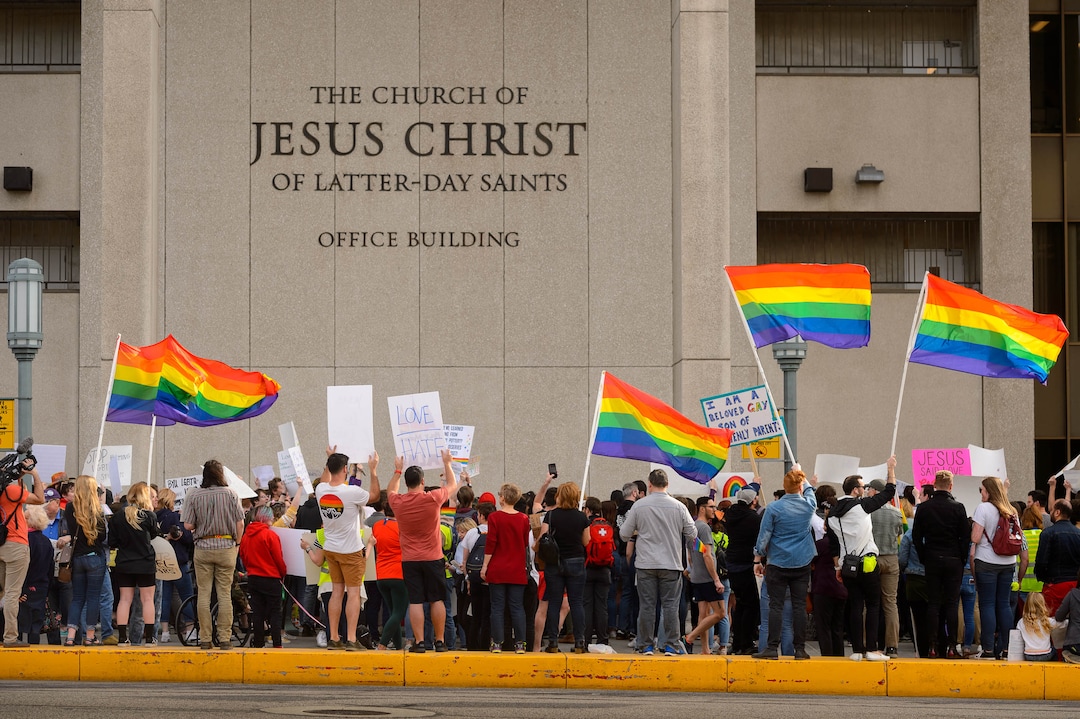 (Trent Nelson  |  The Salt Lake Tribune) Demonstrators at a rally about BYU's changing position on “romantic behavior” by same-sex couples gather in front of the headquarters of The Church of Jesus Christ of Latter-day Saints in Salt Lake City on Friday, March 6, 2020.