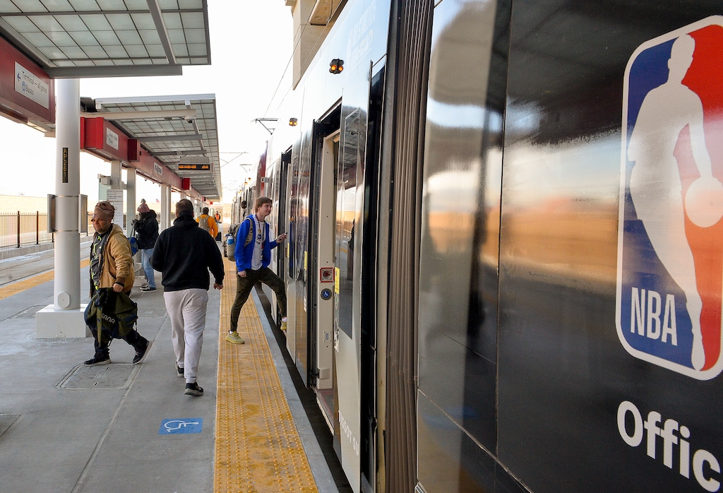 (Chris Samuels | The Salt Lake Tribune) Passengers board a UTA TRAX train at Salt Lake City International Airport, Friday, Feb. 17, 2023.