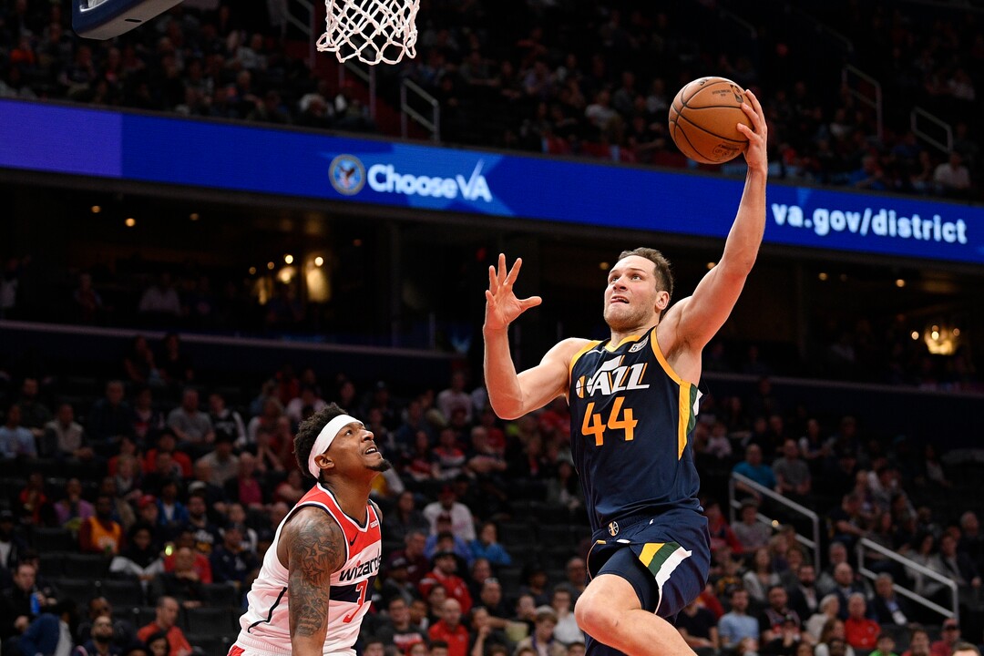 Utah Jazz forward Bojan Bogdanovic (44) goes to the basket against Washington Wizards guard Bradley Beal (3) during the first half of an NBA basketball game, Sunday, Jan. 12, 2020, in Washington. (AP Photo/Nick Wass)
