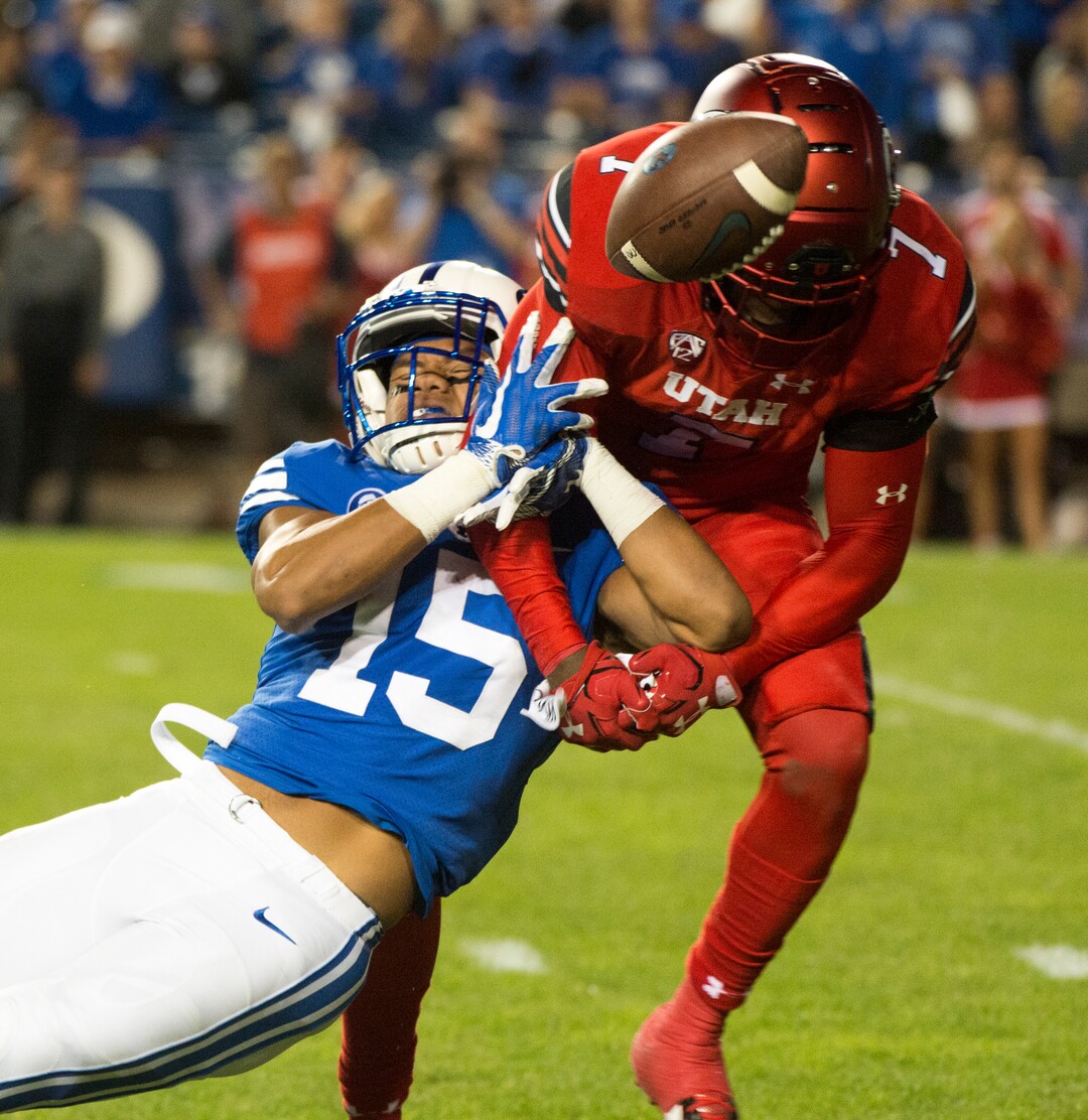 (Rick Egan  |  The Salt Lake Tribune) Utah Utes defensive back Jaylon Johnson (7) breaks up a pass intended for Brigham Young Cougars wide receiver Aleva Hifo (15), in football action BYU vs Utah, at Lavell Edwards Stadium in Provo, Saturday, September 9, 2017.