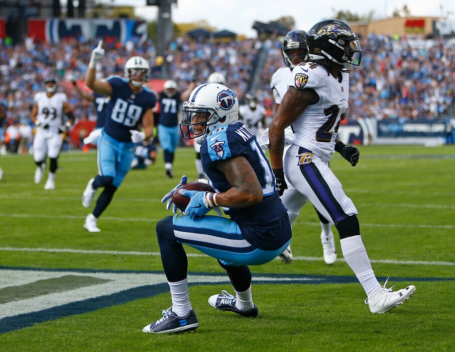 Tennessee Titans wide receiver Rishard Matthews (18) catches a 16-yard touchdown pass ahead of Baltimore Ravens cornerback Brandon Carr (24) in the first half of an NFL football game Sunday, Nov. 5, 2017, in Nashville, Tenn. (AP Photo/Wade Payne)