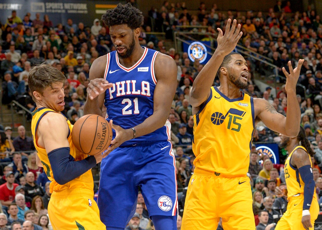 Leah Hogsten  |  The Salt Lake Tribune  Utah Jazz forward Derrick Favors (15) fouls Philadelphia 76ers center Joel Embiid (21). The Philadelphia 76ers defeated the Utah Jazz 114- 97 at Vivint Smart Home Arena, Thursday, December 27, 2018. 