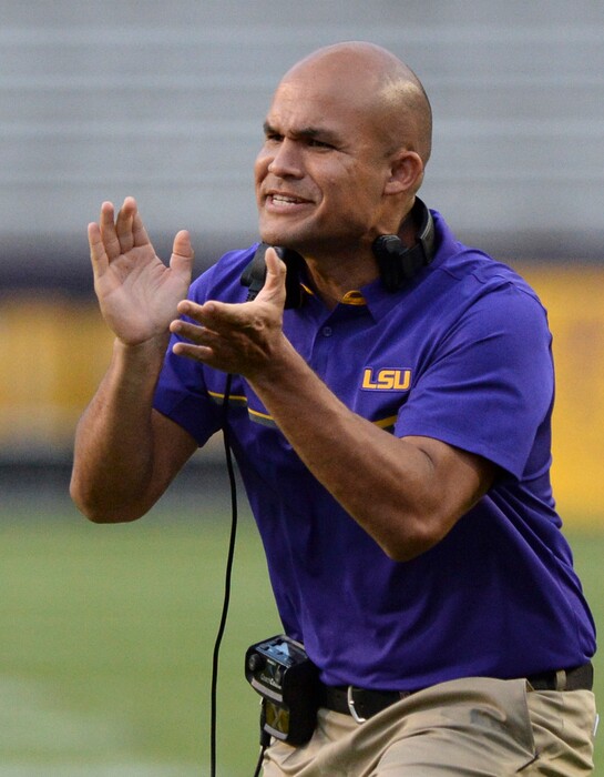 (Hilary Scheinuk  |  The Advocate via AP, File)  FILE -In this April 22, 2017, file photo, LSU defensive coordinator Dave Aranda applauds during the first half of a spring NCAA college football game in Baton Rouge, La. The cerebral 40-year-old begins his second season at LSU after three with Wisconsin as the highest paid assistant coach in college football at $1.8 million this year.