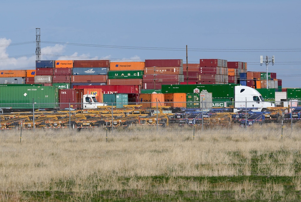 (Francisco Kjolseth | The Salt Lake Tribune) Trucks carrying shipping containers move in and out of the Union Pacific intermodal terminal at a steady pace, west of Salt Lake City, as seen on Wednesday, Nov. 10, 2021.