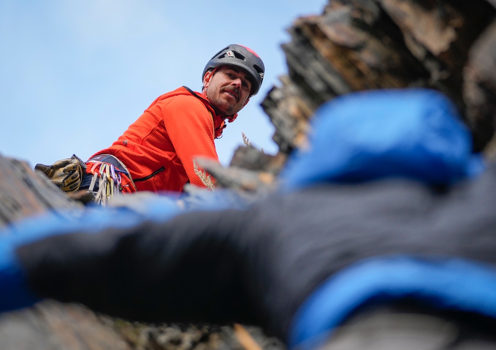 (Bethany Baker  |  The Salt Lake Tribune) John Lemnotis watches as Todd Passey climbs up behind him in Big Cottonwood Canyon near Salt Lake City on Tuesday, Oct. 24, 2023. Neither guide will be able to take clients into Big Cottonwood, Little Cottonwood or Millcreek Canyon starting in January after the Salt Lake Ranger District paused issuing six-month, temporary permits for the lands it oversees in the Uinta-Wasatch-Cache National Forest. The district said it made the decision because of staffing shortages.