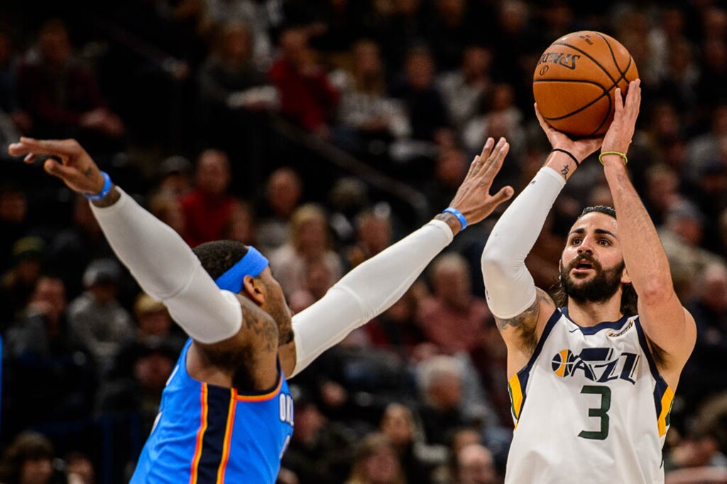 (Trent Nelson | The Salt Lake Tribune)  Utah Jazz guard Ricky Rubio (3) shoots over Oklahoma City Thunder forward Carmelo Anthony (7) as the Utah Jazz host the Oklahoma City Thunder, NBA basketball in Salt Lake City, Saturday December 23, 2017.