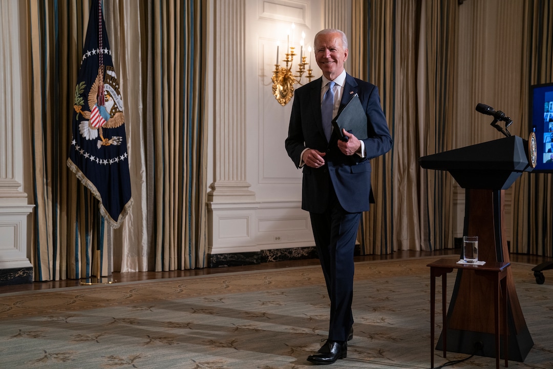 President Joe Biden signs a series of executive orders in the Oval Office of the White House, Wednesday, Jan. 20, 2021, in Washington. (AP Photo/Evan Vucci)
