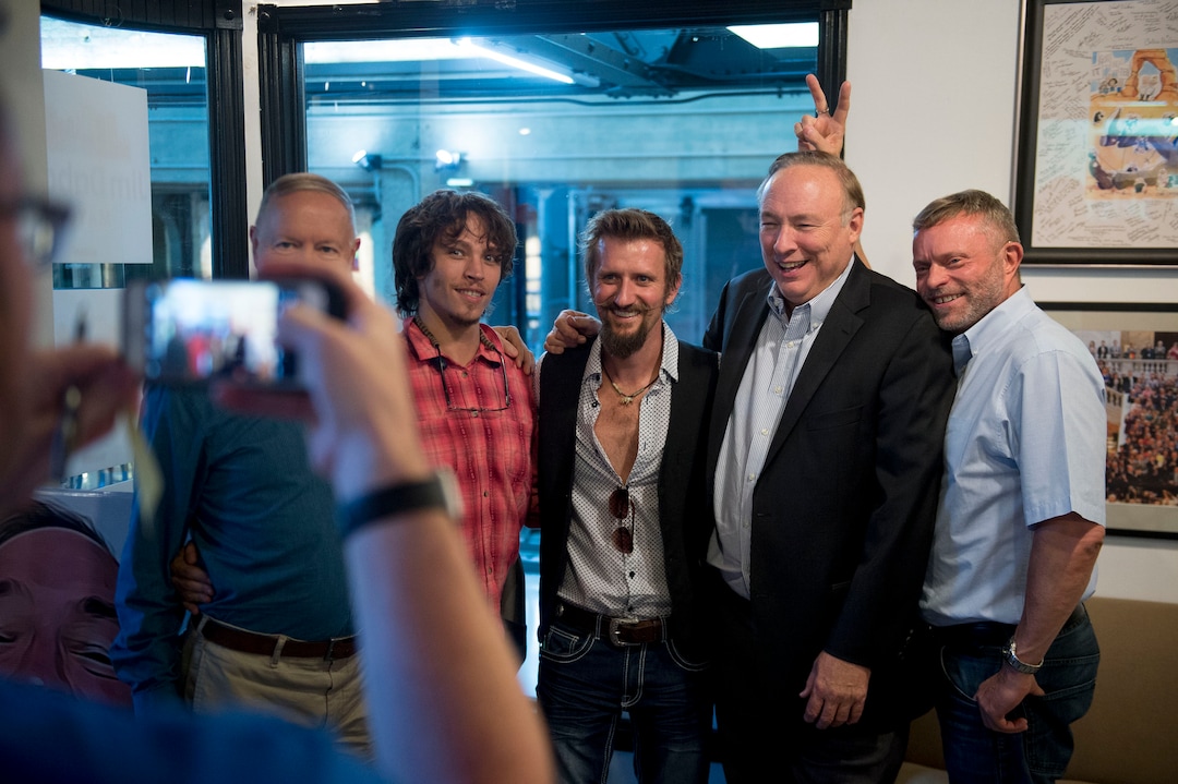 (Jeremy Harmon  |  The Salt Lake Tribune) Jim Dabakis gets bunny ears from his husband, Stephen Justesen, as he poses for a photo with supporters during an election night party in Salt Lake City on Tuesday, August 13, 2019.