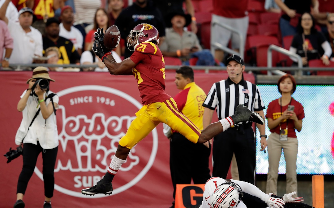 Southern California wide receiver Tyler Vaughns (21) makes a touchdown catch over Utah defensive back Jaylon Johnson (1) during the first half of an NCAA college football game Friday, Sept. 20, 2019, in Los Angeles. (AP Photo/Marcio Jose Sanchez)