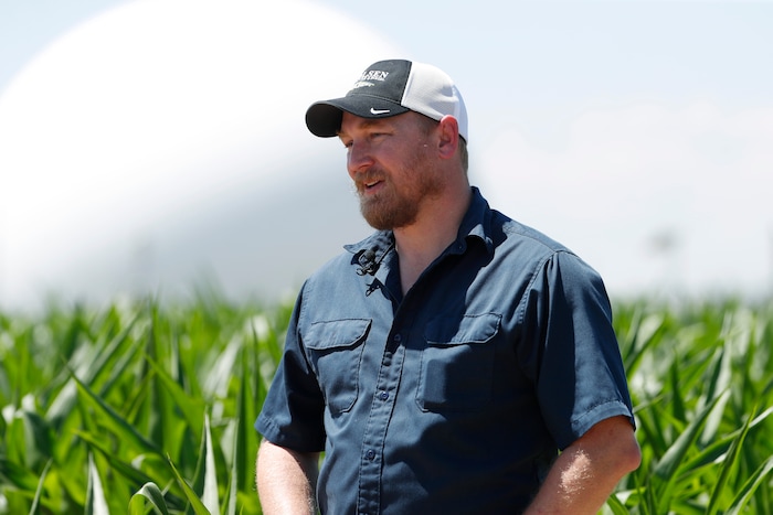 (David Zalubowski | AP Photo) In this Thursday, July 11, 2019, photograph, United States Department of Agriculture Kendall DeJonge at a research farm northeast of Greeley, Colo. Researchers are using drones carrying imaging cameras over the fields in conjunction with stationary sensors connected to the internet to chart the growth of crops in an effort to integrate new technology into the age-old skill of farming.