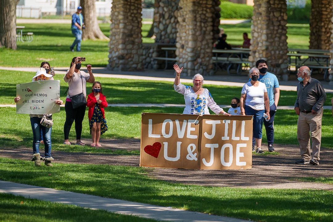 (Trent Nelson  |  The Salt Lake Tribune) People out to see first lady Jill Biden's motorcade in Jordan Park in Salt Lake City on Wednesday, May 5, 2021.