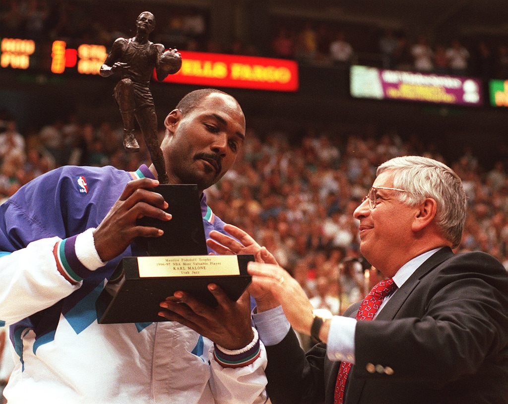 (Tribune file photo) NBA commissioner David Stern presents Karl Malone the MVP trophy for the 1996-97 season.