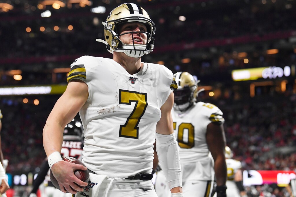 New Orleans Saints quarterback Taysom Hill (7) celebrates a touchdown against the Atlanta Falcons during the first half of an NFL football game, Thursday, Nov. 28, 2019, in Atlanta. (AP Photo/John Amis)