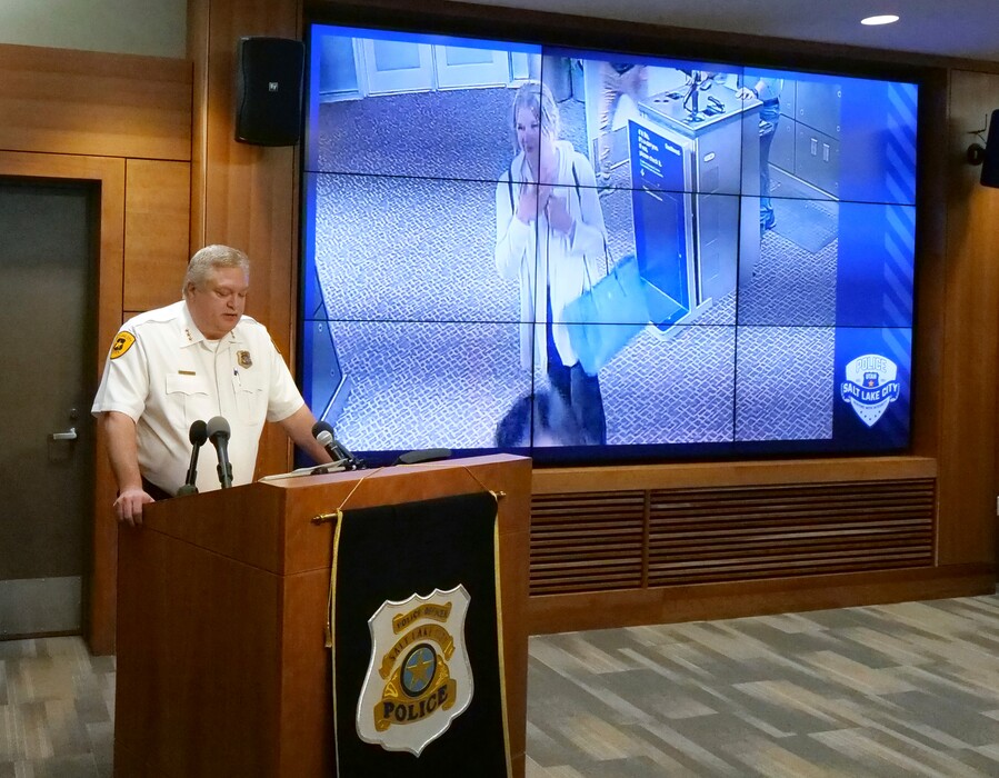 Salt Lake City assistant Police Chief Tim Doubt releases video footage of a missing University of Utah student walking at Salt Lake City International Airport, during a news conference Tuesday, June 25, 2019, in Salt Lake City. Mackenzie Lueck, 23, was last seen June 17, when she took a Lyft car from the airport to a park located miles from her apartment. Police say she didn't seem distressed when she met with someone at about 3 a.m. (AP Photo/Rick Bowmer)