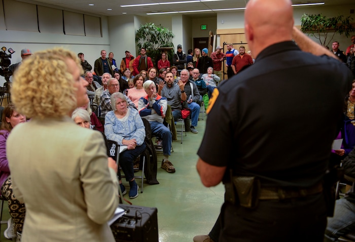(Steve Griffin  |  The Salt Lake Tribune) Christopher Sanchez, center, asks Salt Lake City Mayor Jackie Biskupski and Salt Lake City Police Chief Mike Brown about Operation Rio Grande during the Liberty Wells Community Council meeting at the Tracy Aviary education room in Salt Lake City Wednesday November 8, 2017.