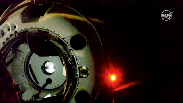 In this image taken from NASA Television, Sunday, March 3, 2019. SpaceX's new crew capsule approaches just before docking at the International Space Station Sunday, March 3, 2019. SpaceX's new crew capsule arrived at the International Space Station, acing its second milestone in just over a day. No one was aboard the Dragon capsule launched Saturday on its first test flight, only an instrumented dummy. (NASA TV via AP)