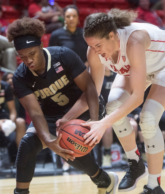(Rick Egan  |  The Salt Lake Tribune)  Utah Utes forward Emily Potter (12) goes for the ball along with Purdue Boilermakers guard Miracle Gray (5), in basketball action Utah Utes vs. Purdue Boilermakers, at the Jon M. Huntsman Center, Monday, Nov. 20, 2017.