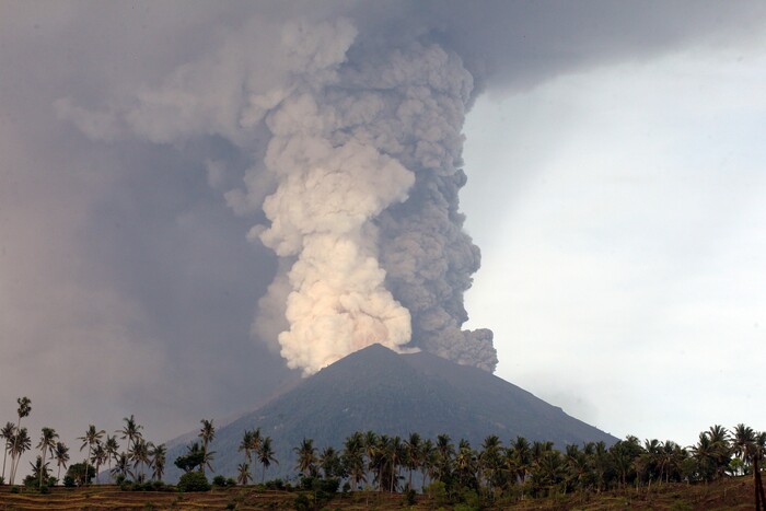 (Firdia Lisnawati | The Associated Press) A view of the Mount Agung volcano erupting in Karangasem, Bali, Indonesia, Monday, Nov. 27, 2017. The volcano on the Indonesian tourist island of Bali erupted for the second time in a week on Saturday, disrupting international flights even as authorities said the island remains safe.