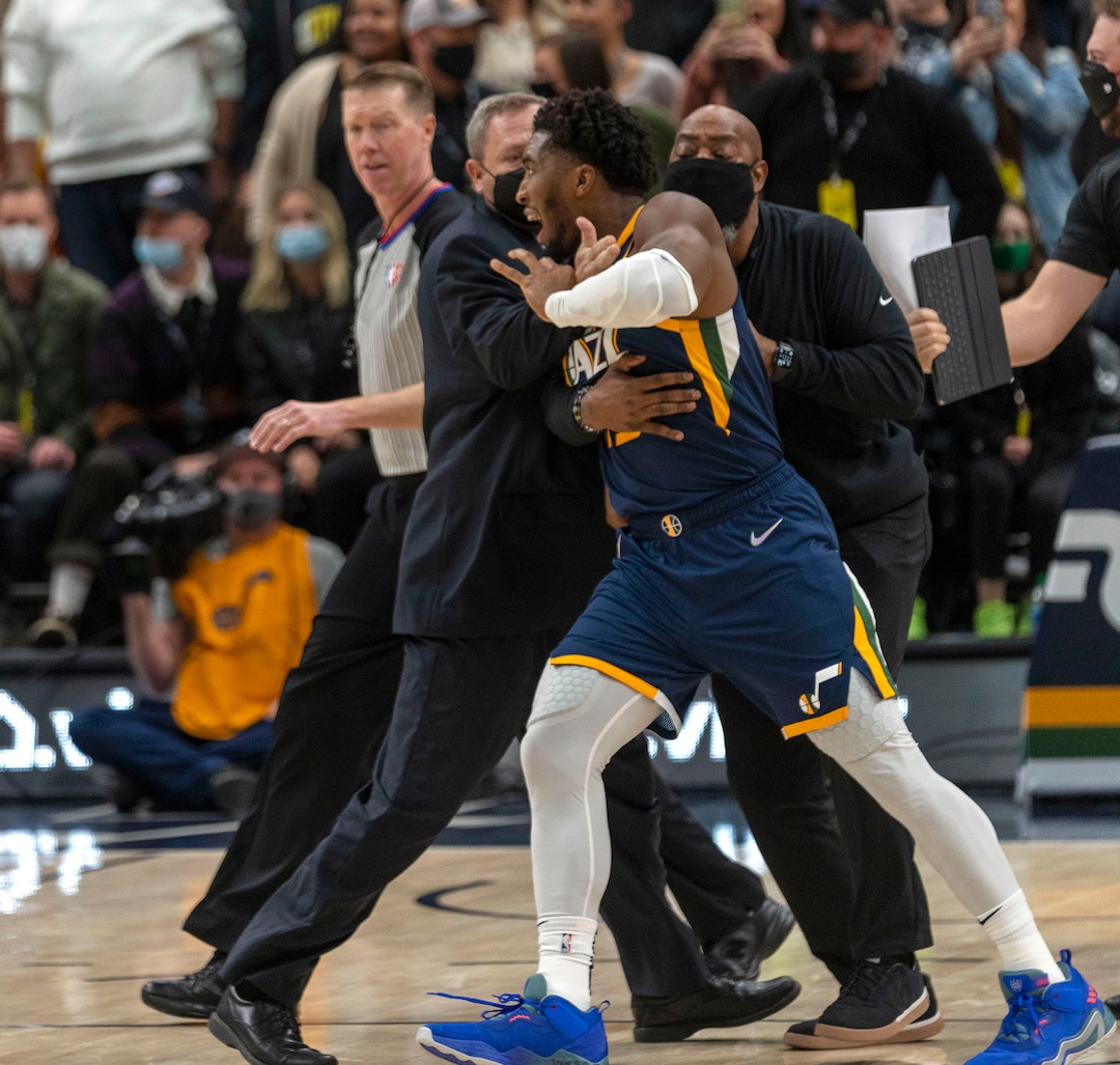 (Rick Egan | The Salt Lake Tribune) Security tries to hold back Utah Jazz guard Donovan Mitchell (45) from getting to the Indiana Pacers bench after Indiana center Miles Turner scuffled with Jazz center Rudy Gobert, resulting in 4 ejections, in the 4th quarter, in NBA action between Utah Jazz and Indiana Pacers at Vivint Arena, on Thursday, Nov. 11, 2021.
