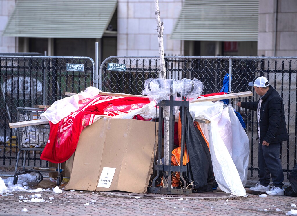 (Rick Egan | The Salt Lake Tribune)  A man packs up his belongings during the abatement on 500 West earlier in the day, on Thursday, March 2, 2023.