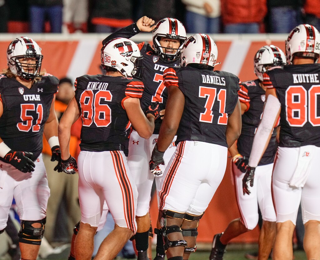 (Leah Hogsten | The Salt Lake Tribune) Utah Utes quarterback Cameron Rising (7) celebrates his touchdown with the team as the University of Utah hosts the Arizona Sun Devils in Pac-12 action at Rice-Eccles Stadium, Oct. 10, 2021. 