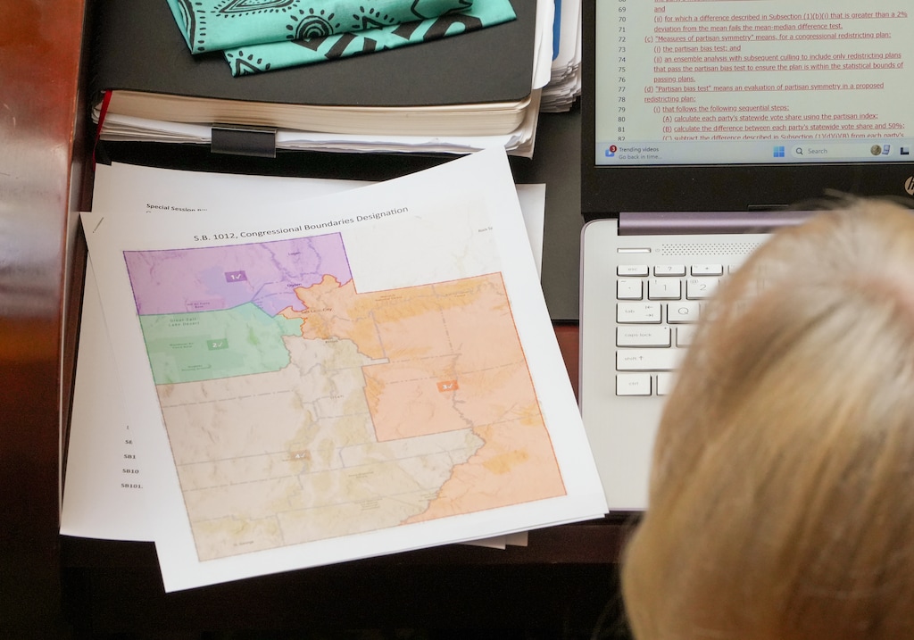 (Chris Samuels | The Salt Lake Tribune) A proposed Congressional map sits at the desk of a legislator during a special session of the House of Representatives at the Capitol in Salt Lake City, Monday, Oct. 6, 2025.