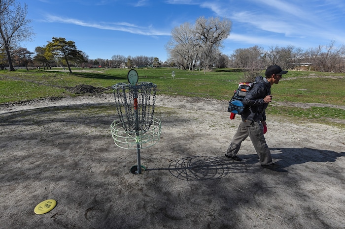 (Francisco Kjolseth  |  The Salt Lake Tribune)  Bill Richland tries out the Roots Disc Golf Course in the Rose Park neighborhood, site of one of the original disc golf courses in Utah before becoming a ball golf course for nearly 20 years. PGA Tour golfer Tony Finau grew up playing the Jordan River Par-3 course that has been converted back to a disc golf venue.