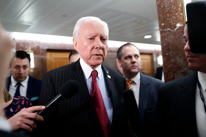 Senate Health, Education, Labor, and Pensions Committee member Sen. Orrin Hatch, R-Utah, center, leaves the committee's executive session on Education Secretary-designate Betsy DeVos, Tuesday, Jan. 31, 2017, on Capitol Hill in Washington. (AP Photo/Alex Brandon)