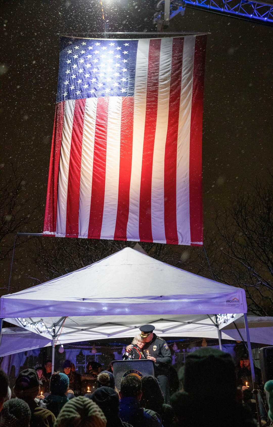 (Keith Johnson | Special to The Tribune) South Salt Lake Police Chief Jack Carruth hugs the mother of Officer David Romrell during a candlelight vigil Dec. 2, 2018 at the Columbus Community Center in South Salt Lake for Officer Romrell, a South Salt Lake police officer killed in the line of duty Nov. 24, when he was struck by a car driven by a fleeing suspect. Several hundred members of the community attended the vigil including family, friends, South Salt Lake Mayor Cherie Wood and representatives from the Utah Highway Patrol, Unified Police and Unified Fire.
