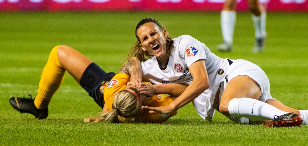 (Rick Egan  |  The Salt Lake Tribune)    Utah Royals FC midfielder Gunnhildur Jónsdóttir (66) collides with Portland Thorns FC defender Katherine Reynolds (2), in Soccer action between Utah Royals FC and Portland Thorns FC, in Sandy, Friday, July 19, 2019.