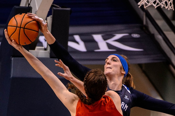 (Trent Nelson | The Salt Lake Tribune)  Brigham Young Cougars center Sara Hamson (22) blocks a shot by Utah Utes center Megan Huff (5) as BYU hosts Utah, NCAA women's basketball in Provo, Saturday December 9, 2017.