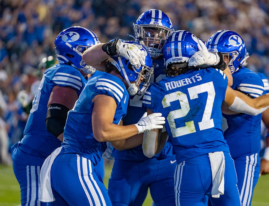 (Rick Egan | The Salt Lake Tribune)  Brigham Young Cougars celebrate after wide receiver Chase Roberts (27) scores a touchdown for the Cougars, in football action between the Brigham Young Cougars and the Baylor Bears at LaVell Edwards Stadium in Provo, on Saturday, Sept. 10, 2022.