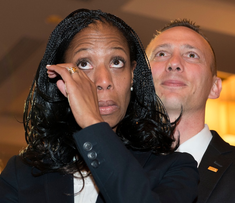 Steve Griffin  |  The Salt Lake TribuneMia Love wipes tears from her eyes as she stands with her husband, Jason, right, as she is introduced as the winner of her congressional race in Utah's 4th district  Salt Lake City, Wednesday, November 5, 2014. 