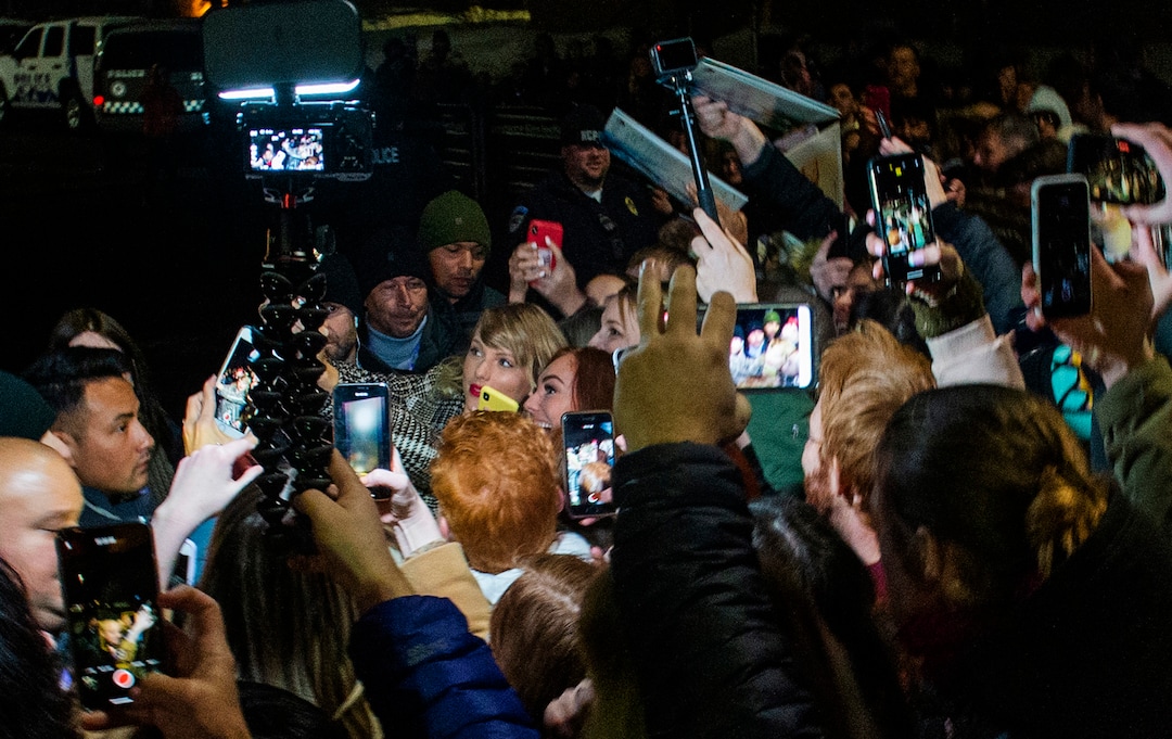 Taylor Swift takes selfies with fans outside the Eccles Theatre before the premiere of her film "Taylor Swift: Miss Americana." on the opening night of the 2020 Sundance Film Festival, in Park City, Thursday, Jan. 23, 2020.