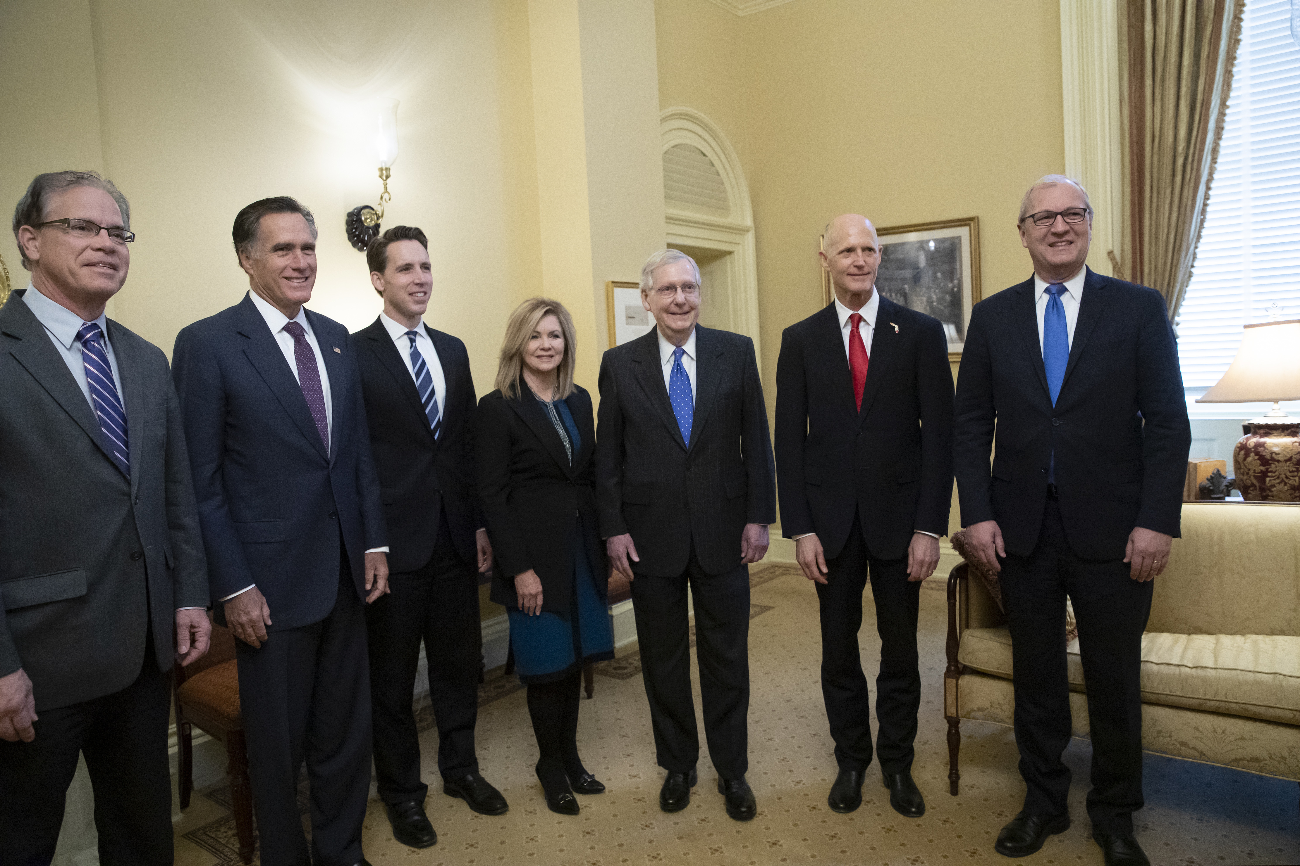 Senate Majority Leader Mitch McConnell, R-Ky., center, meets with incoming GOP senators for the 116th Congress, at the Capitol in Washington, Wednesday, Nov. 14, 2018. From left are, Sen.-elect Mike Braun, R-Ind., Sen.-elect Mitt Romney, R-Utah, Sen.-elect Josh Hawley, R-Mo., Sen.-elect Marsha Blackburn, R-Tenn., Majority Leader Mitch McConnell, R-Ky., Florida Gov. Rick Scott, the Republican candidate in the undecided race for Senate from Florida, and Sen.-elect Kevin Cramer, R-N.D. (AP Photo/J. Scott Applewhite)